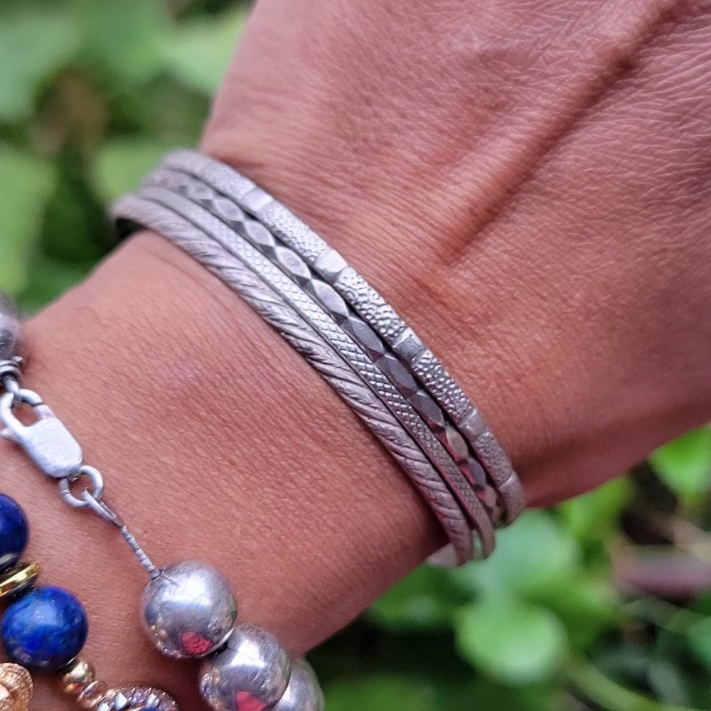 Awesome four textured silver bangle set stack